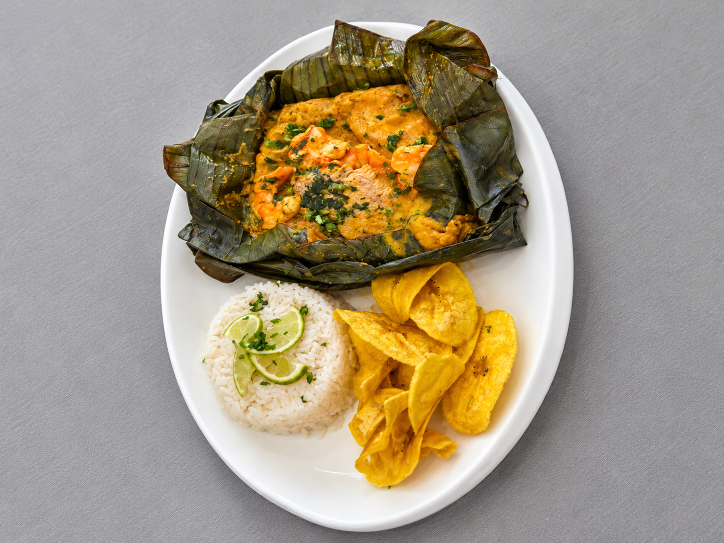Mixed bollo served with rice and house sides at Floritas Delicias Latinas in East Orange, NJ.